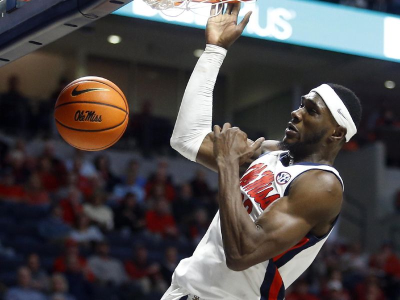 Jan 10, 2024; Oxford, Mississippi, USA; Mississippi Rebels forward Moussa Cisse (33) dunks during the second half against the Florida Gators at The Sandy and John Black Pavilion at Ole Miss. Mandatory Credit: Petre Thomas-USA TODAY Sports