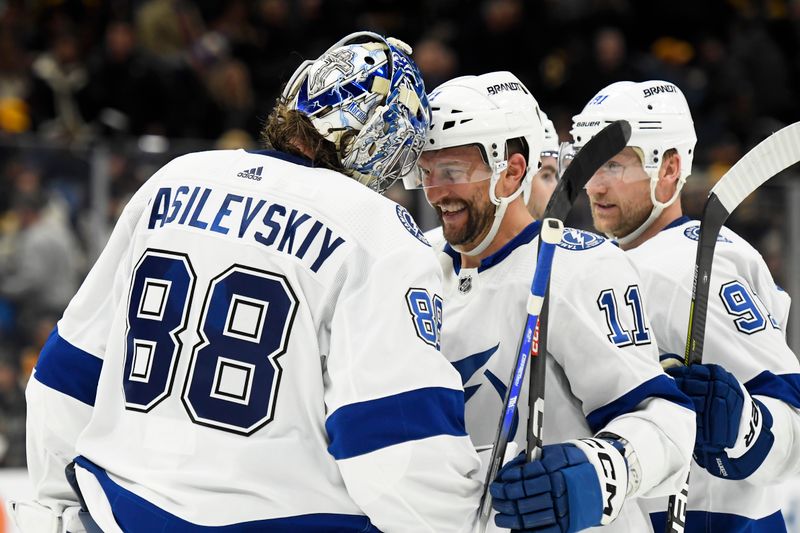 Feb 13, 2024; Boston, Massachusetts, USA;  Tampa Bay Lightning goaltender Andrei Vasilevskiy (88) and center Luke Glendening (11) celebrate after beating the Boston Bruins in a shootout at TD Garden. Mandatory Credit: Bob DeChiara-USA TODAY Sports