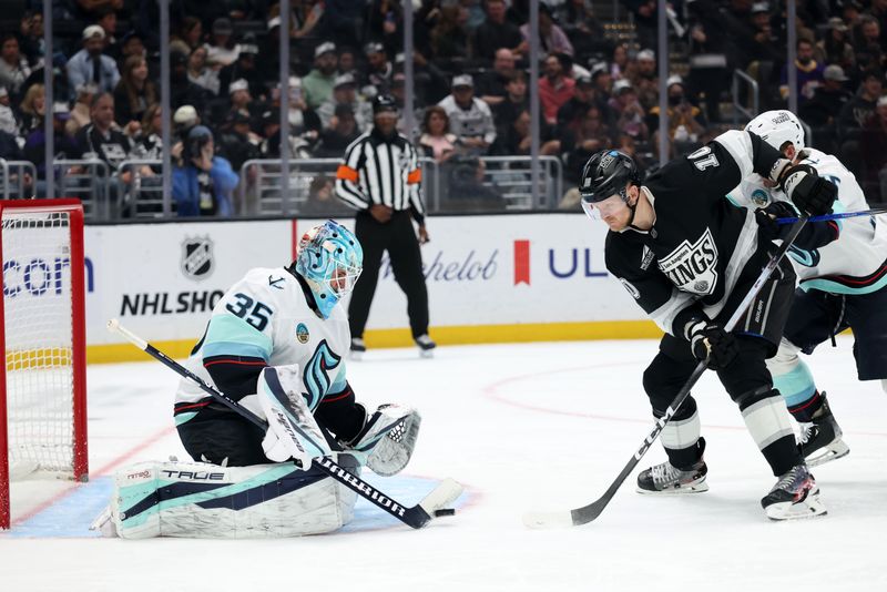 Feb 4, 2026; Los Angeles, California, USA;  Seattle Kraken goaltender Joey Daccord (35) defends the goal against Los Angeles Kings right wing Corey Perry (10) during the second period at Crypto.com Arena. Mandatory Credit: Kiyoshi Mio-Imagn Images