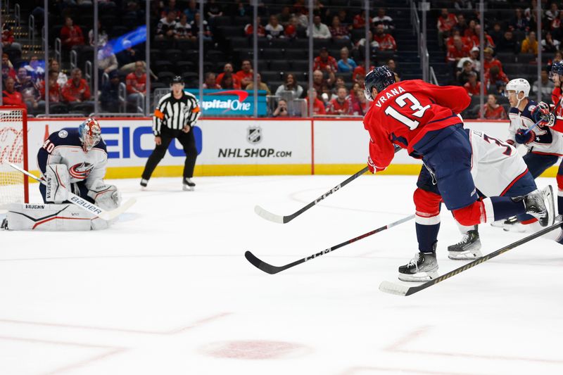 Sep 27, 2024; Washington, District of Columbia, USA; Washington Capitals forward Jakob Vrana (13) scores a goal on Columbus Blue Jackets goaltender Daniil Tarasov (40) in the first period at Capital One Arena. Mandatory Credit: Geoff Burke-Imagn Images