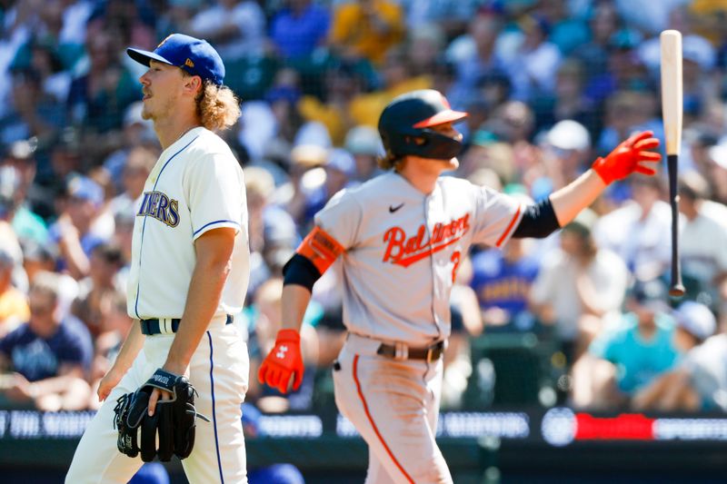 Aug 13, 2023; Seattle, Washington, USA; Seattle Mariners starting pitcher Bryce Miller (50) returns to the mound after surrendering a run to a sacrifice-fly by Baltimore Orioles shortstop Gunnar Henderson (2, background) during the third inning at T-Mobile Park. Mandatory Credit: Joe Nicholson-USA TODAY Sports