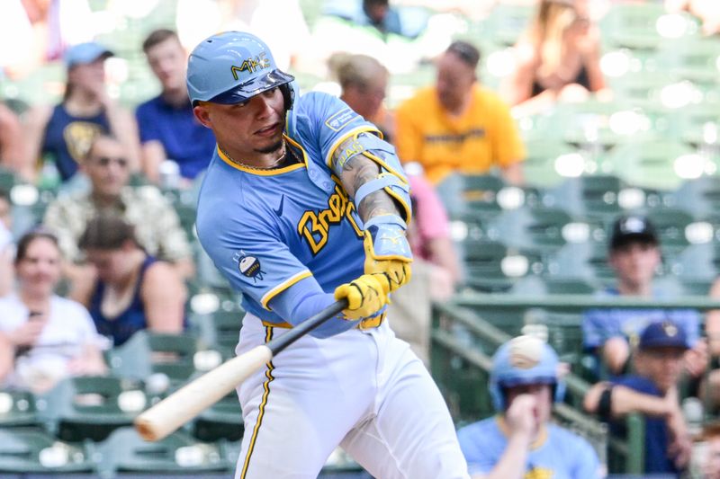 Jul 14, 2024; Milwaukee, Wisconsin, USA; Milwaukee Brewers catcher William Contreras (24) hits a solo home run in the third inning against the Washington Nationals at American Family Field. Mandatory Credit: Benny Sieu-USA TODAY Sports