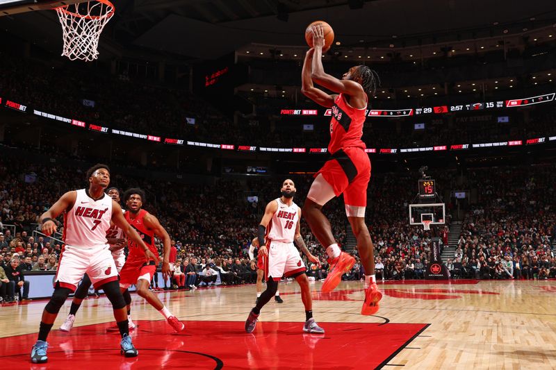 TORONTO, CANADA - JANUARY 17: Immanuel Quickley #5 of the Toronto Raptors drives to the basket during the game against the Miami Heat on January 17, 2024 at the Scotiabank Arena in Toronto, Ontario, Canada.  NOTE TO USER: User expressly acknowledges and agrees that, by downloading and or using this Photograph, user is consenting to the terms and conditions of the Getty Images License Agreement.  Mandatory Copyright Notice: Copyright 2024 NBAE (Photo by Vaughn Ridley/NBAE via Getty Images)