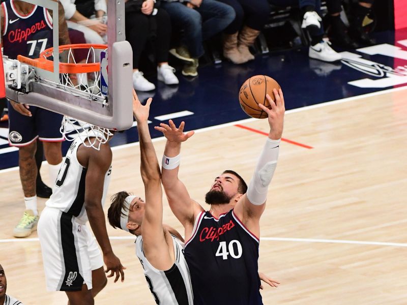 INGLEWOOD, CA - NOVEMBER 4: Ivica Zubac #40 of the LA Clippers drives to the basket during the game against the San Antonio Spurs on November 4, 2024 at Intuit Dome in Los Angeles, California. NOTE TO USER: User expressly acknowledges and agrees that, by downloading and/or using this Photograph, user is consenting to the terms and conditions of the Getty Images License Agreement. Mandatory Copyright Notice: Copyright 2024 NBAE (Photo by Adam Pantozzi/NBAE via Getty Images)