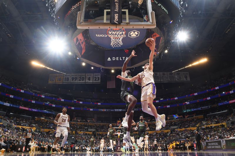 LOS ANGELES, CA - APRIL 7: Austin Reaves #15 of the Los Angeles Lakers drives to the basket during the game against the Minnesota Timberwolves on April 7, 2024 at Crypto.Com Arena in Los Angeles, California. NOTE TO USER: User expressly acknowledges and agrees that, by downloading and/or using this Photograph, user is consenting to the terms and conditions of the Getty Images License Agreement. Mandatory Copyright Notice: Copyright 2024 NBAE (Photo by Juan Ocampo/NBAE via Getty Images)