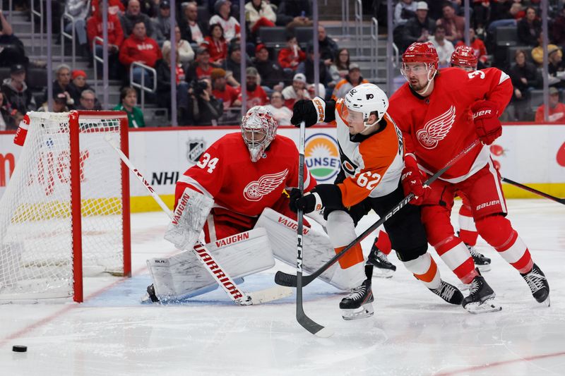 Jan 25, 2024; Detroit, Michigan, USA;  Philadelphia Flyers right wing Olle Lycksell (62) and Detroit Red Wings defenseman Justin Holl (3) fight for position in front of Detroit Red Wings goaltender Alex Lyon (34) in the third periodat Little Caesars Arena. Mandatory Credit: Rick Osentoski-USA TODAY Sports