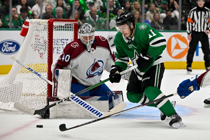 May 7, 2024; Dallas, Texas, USA; Dallas Stars center Logan Stankoven (11) looks to poke the puck past Colorado Avalanche goaltender Alexandar Georgiev (40) during the second period in game one of the second round of the 2024 Stanley Cup Playoffs at American Airlines Center. Mandatory Credit: Jerome Miron-USA TODAY Sports