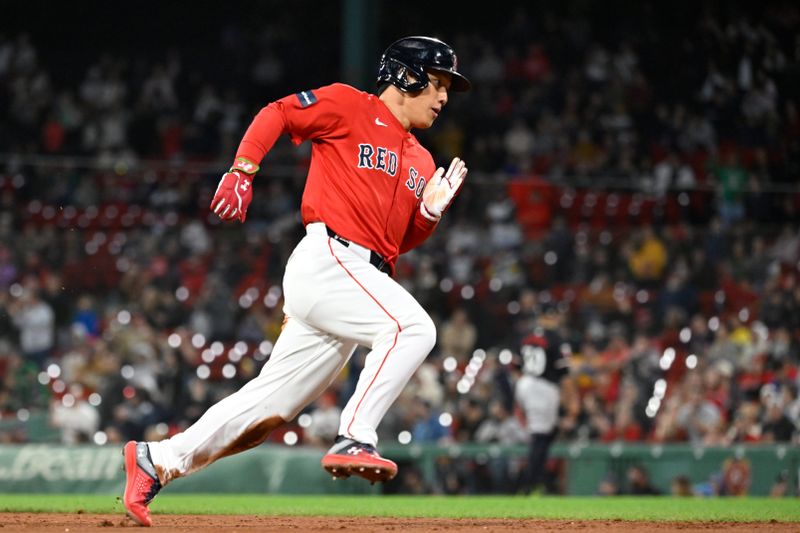 Sep 22, 2024; Boston, MA, USA;  Boston Red Sox designated hitter Masataka Yoshida (7) scores on an RBI by catcher Connor Wong (12)  (not pictured) during the sixth inning against the Minnesota Twins at Fenway Park. Mandatory Credit: Eric Canha-Imagn Images