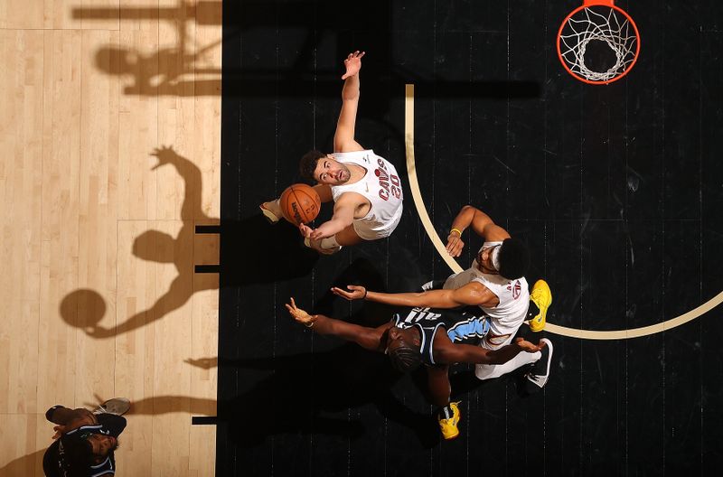 ATLANTA, GEORGIA - MARCH 06:  Georges Niang #20 and Jarrett Allen #31 of the Cleveland Cavaliers battle for a rebound against Clint Capela #15 of the Atlanta Hawks during the first quarter at State Farm Arena on March 06, 2024 in Atlanta, Georgia.  NOTE TO USER: User expressly acknowledges and agrees that, by downloading and/or using this photograph, user is consenting to the terms and conditions of the Getty Images License Agreement.  (Photo by Kevin C. Cox/Getty Images)