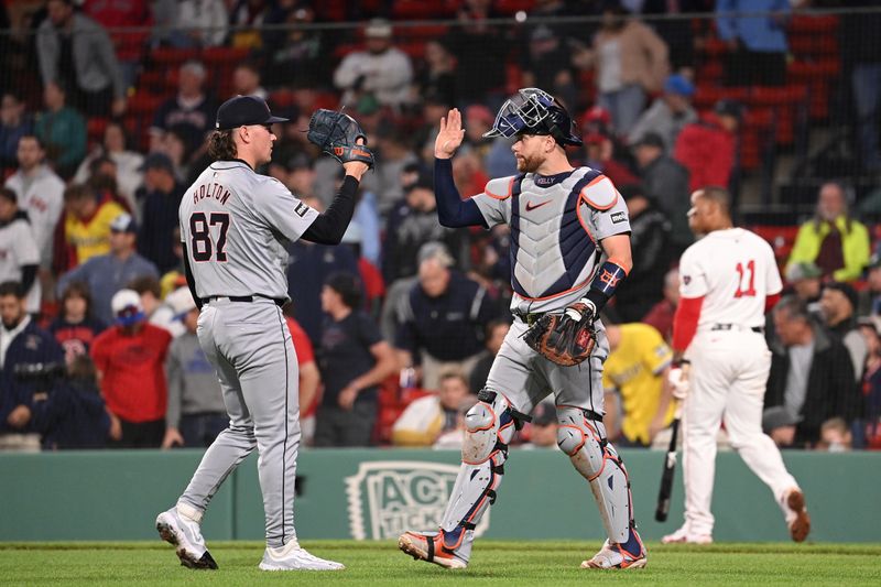 May 30, 2024; Boston, Massachusetts, USA; Detroit Tigers pitcher Tyler Holton (87) and catcher Carson Kelly (15) celebrate defeating the Boston Red Sox at Fenway Park. Mandatory Credit: Eric Canha-USA TODAY Sports