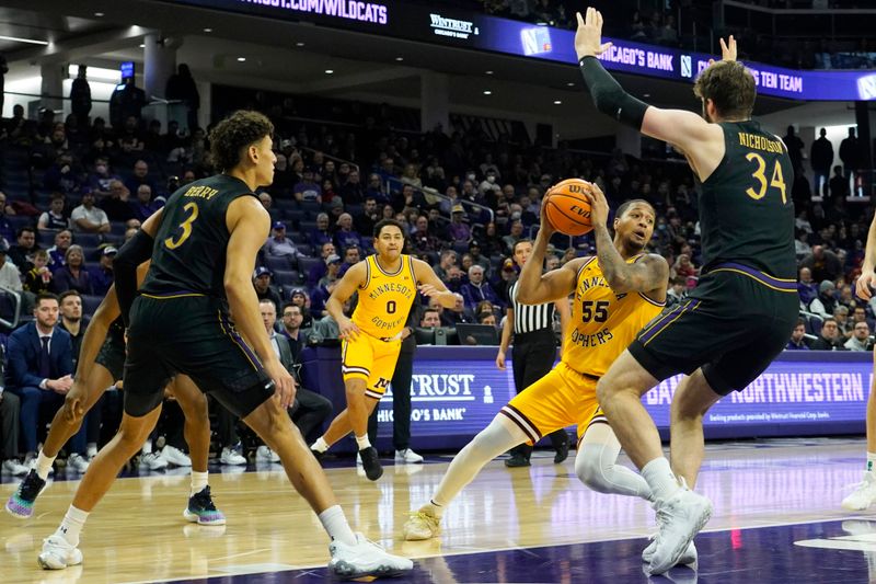 Jan 28, 2023; Evanston, Illinois, USA; Northwestern Wildcats center Matthew Nicholson (34) defends Minnesota Golden Gophers guard Ta'lon Cooper (55) during the first half at Welsh-Ryan Arena. Mandatory Credit: David Banks-USA TODAY Sports