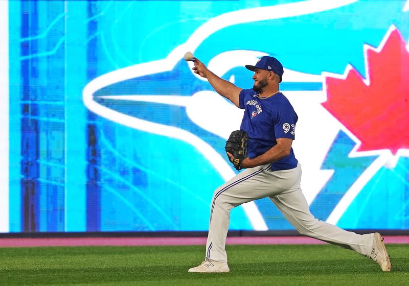 Aug 30, 2023; Toronto, Ontario, CAN; Toronto Blue Jays relief pitcher Yimi Garcia (93) throws a ball during batting practice before a game against the Washington Nationals at Rogers Centre. Mandatory Credit: Nick Turchiaro-USA TODAY Sports