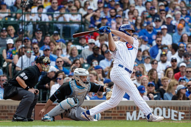 May 5, 2023; Chicago, Illinois, USA; Chicago Cubs first baseman Matt Mervis (22) hits an RBI-single against the Miami Marlins during the eight inning at Wrigley Field. Mandatory Credit: Kamil Krzaczynski-USA TODAY Sports