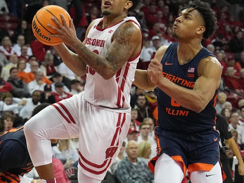 Jan 1, 2023; Madison, Wis, USA; Wisconsin guard Chucky Hepburn (23) drives past Illinois guard Terrence Shannon Jr. (0) during the second half of their game  at the Kohl Center. Mandatory Credit: Mark Hoffman/Milwaukee Journal Sentinel via USA TODAY NETWORK