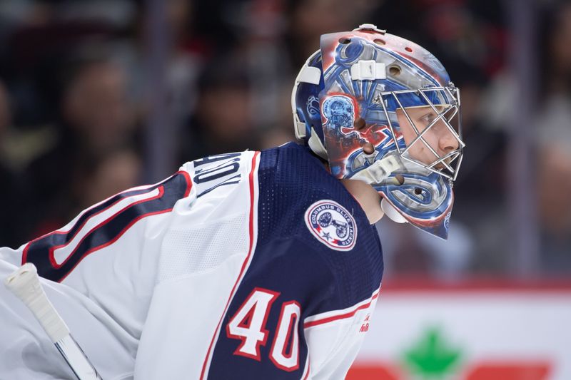 Feb 13, 2024; Ottawa, Ontario, CAN; Columbus Blue Jackets \goalie Daniil Tarasov (40) looks up the ice in the first period against the  Ottawa Senators at the Canadian Tire Centre. Mandatory Credit: Marc DesRosiers-USA TODAY Sports