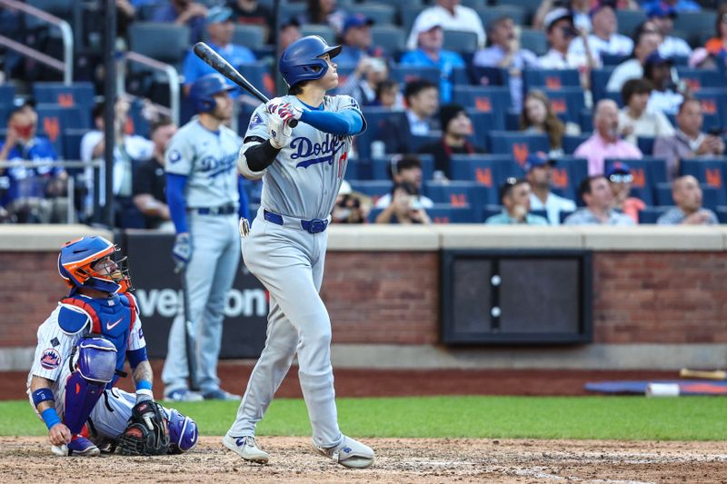 May 29, 2024; New York City, New York, USA;  Los Angeles Dodgers designated hitter Shohei Ohtani (17) hits a two rum home run in the eighth inning against the New York Mets at Citi Field. Mandatory Credit: Wendell Cruz-USA TODAY Sports