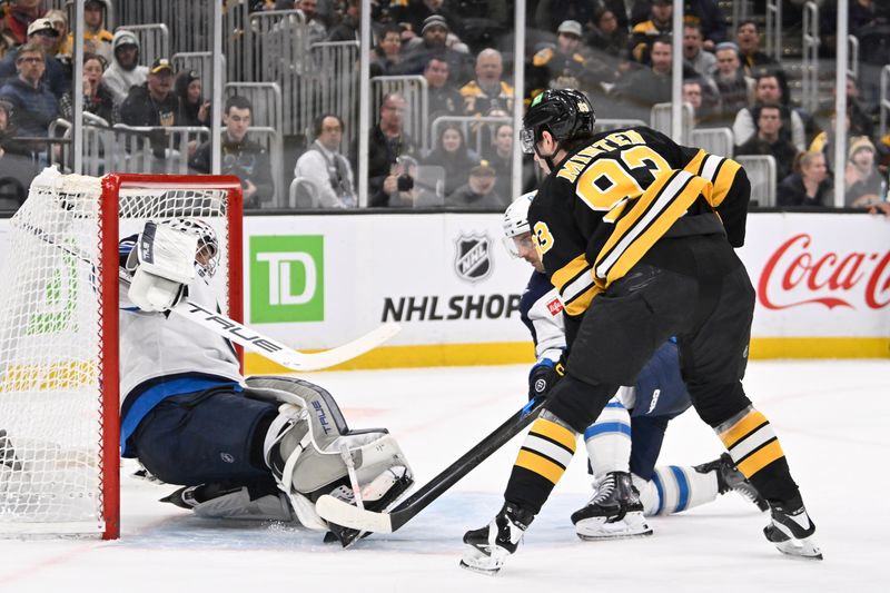 Mar 19, 2026; Boston, Massachusetts, USA; Boston Bruins center Fraser Minten (93) scores a goal against Winnipeg Jets goaltender Connor Hellebuyck (37) during the third period at TD Garden. Mandatory Credit: Eric Canha-Imagn Images