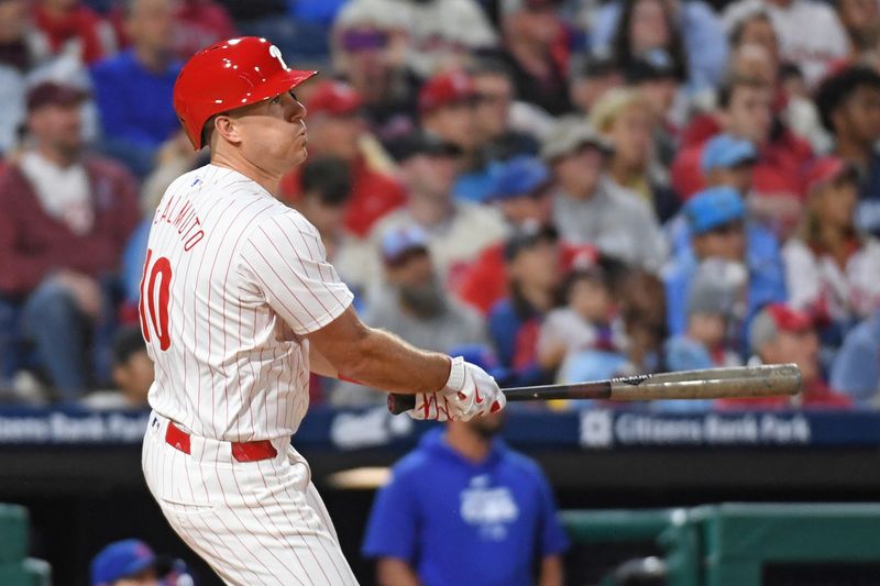 Sep 23, 2024; Philadelphia, Pennsylvania, USA; Philadelphia Phillies catcher J.T. Realmuto (10) hits a home run during the second inning against the Chicago Cubs at Citizens Bank Park. Mandatory Credit: Eric Hartline-Imagn Images