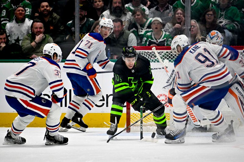 Apr 3, 2024; Dallas, Texas, USA; Dallas Stars center Logan Stankoven (11) digs for the puck by Edmonton Oilers left wing Warren Foegele (37) and center Ryan McLeod (71) and left wing Evander Kane (91) during the first period at the American Airlines Center. Mandatory Credit: Jerome Miron-USA TODAY Sports