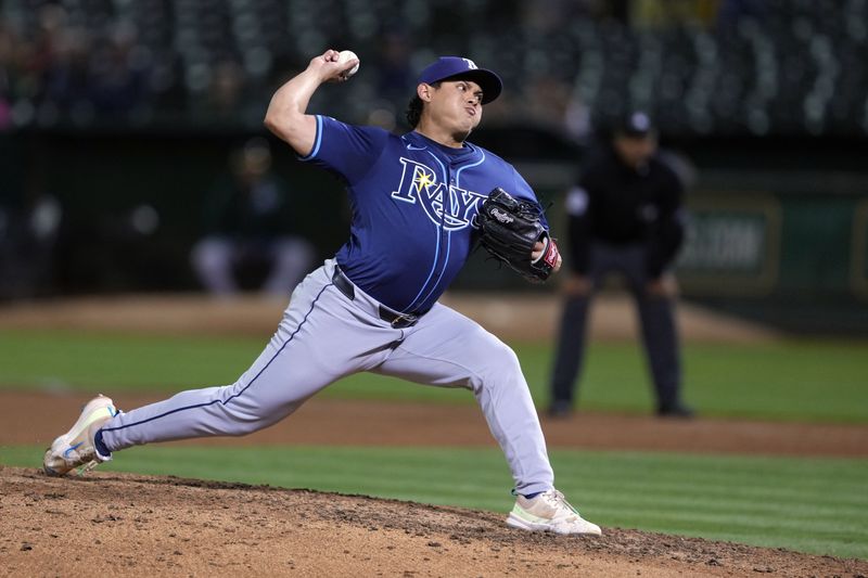 Aug 21, 2024; Oakland, California, USA; Tampa Bay Rays relief pitcher Manuel Rodriguez (39) throws a pitch against the Oakland Athletics during the ninth inning at Oakland-Alameda County Coliseum. Mandatory Credit: Darren Yamashita-USA TODAY Sports