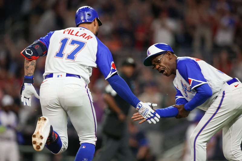 May 6, 2023; Atlanta, Georgia, USA; Atlanta Braves left fielder Kevin Pillar (17) celebrates with third base coach Ron Washington (37) after hitting a two run home run against the Baltimore Orioles in the eighth inning at Truist Park. Mandatory Credit: Brett Davis-USA TODAY Sports