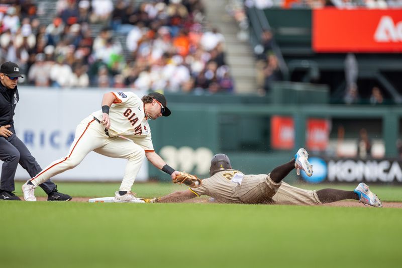 Sep 15, 2024; San Francisco, California, USA; San Diego Padres shortstop Xander Bogaerts (21) steals second under the tag of San Francisco Giants shortstop Brett Wisely (0) ninth inning at Oracle Park. Mandatory Credit: Bob Kupbens-Imagn Images