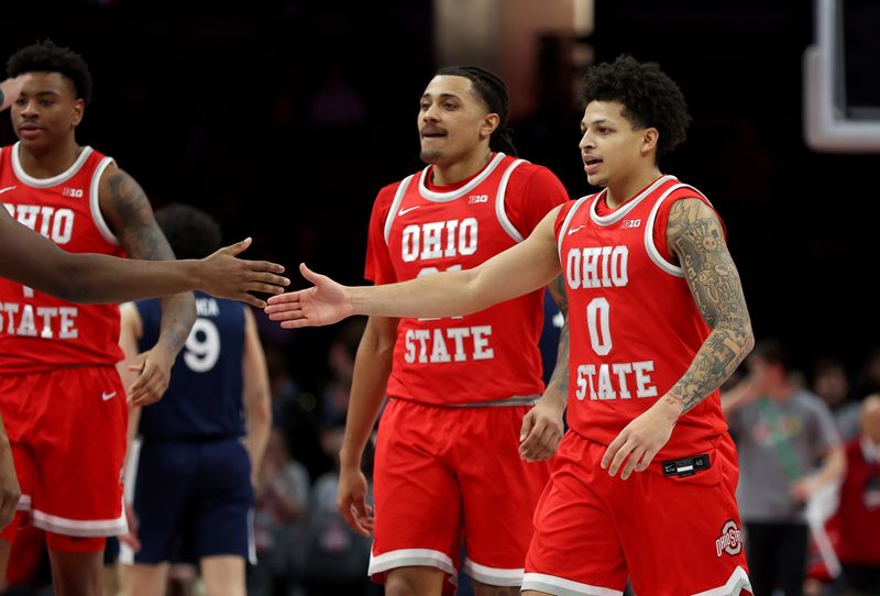 Jan 26, 2026; Columbus, Ohio, USA; Ohio State Buckeyes guard John Mobley Jr. (0) is congratulated by teammates during the second half against the Penn State Nittany Lions at Value City Arena. Mandatory Credit: Joseph Maiorana-Imagn Images