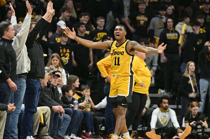 Jan 20, 2024; Iowa City, Iowa, USA; Iowa Hawkeyes guard Tony Perkins (11) reacts with the crowd during the second half against the Purdue Boilermakers at Carver-Hawkeye Arena. Mandatory Credit: Jeffrey Becker-USA TODAY Sports