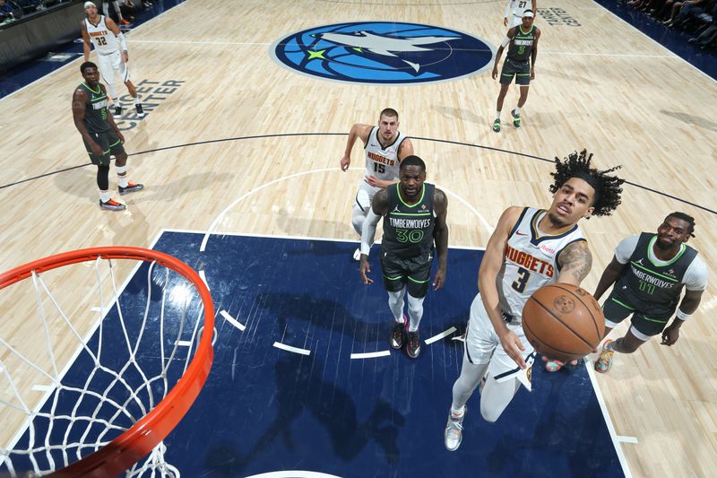 MINNEAPOLIS, MN -  NOVEMBER 1: Julian Strawther #3 of the Denver Nuggets drives to the basket during the game against the Minnesota Timberwolves on November 1, 2024 at Target Center in Minneapolis, Minnesota. NOTE TO USER: User expressly acknowledges and agrees that, by downloading and or using this Photograph, user is consenting to the terms and conditions of the Getty Images License Agreement. Mandatory Copyright Notice: Copyright 2024 NBAE (Photo by David Sherman/NBAE via Getty Images)