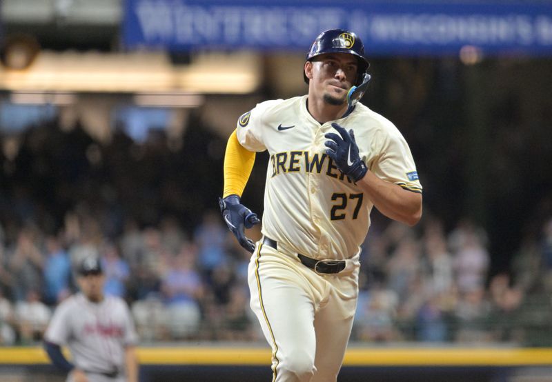 Jul 29, 2024; Milwaukee, Wisconsin, USA; Milwaukee Brewers shortstop Willy Adames (27) rounds the bases after hitting a home run against the Atlanta Braves in the sixth inning at American Family Field. Mandatory Credit: Michael McLoone-USA TODAY Sports