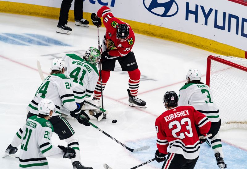 Apr 6, 2024; Chicago, Illinois, USA; Chicago Blackhawks center Jason Dickinson (16) attempts to score against the Dallas Stars during the second period at United Center. Mandatory Credit: Seeger Gray-USA TODAY Sports