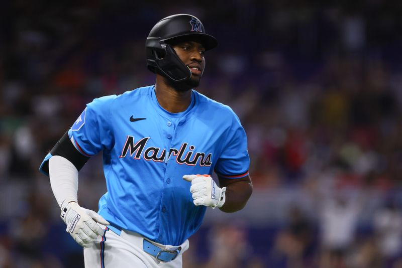 Aug 11, 2024; Miami, Florida, USA; Miami Marlins right fielder Jesus Sanchez (12) circles the bases after hitting a two-run home run against the San Diego Padres during the seventh inning at loanDepot Park. Mandatory Credit: Sam Navarro-USA TODAY Sports