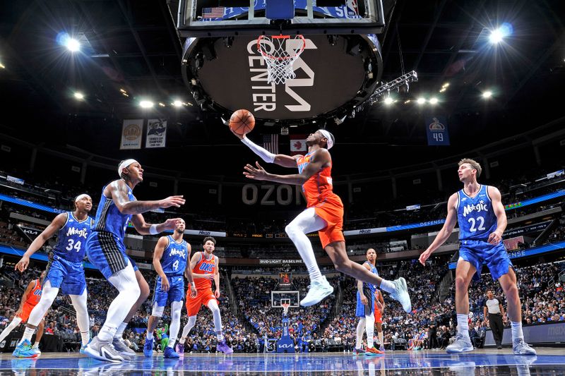 ORLANDO, FL - FEBRUARY 13: Shai Gilgeous-Alexander #2 of the Oklahoma City Thunder shoots the ball during the game against the Orlando Magic on February 13, 2024 at the Kia Center in Orlando, Florida. NOTE TO USER: User expressly acknowledges and agrees that, by downloading and or using this photograph, User is consenting to the terms and conditions of the Getty Images License Agreement. Mandatory Copyright Notice: Copyright 2024 NBAE (Photo by Fernando Medina/NBAE via Getty Images)