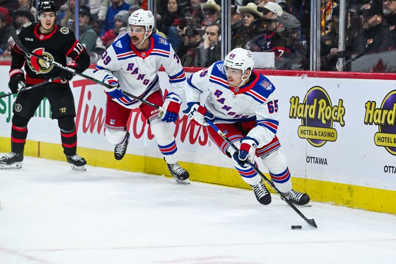 Dec 4, 2025; Ottawa, Ontario, CAN; New York Rangers left wing Brett Berard (65) plays the puck against the Ottawa Senators during the second period at Canadian Tire Centre. Mandatory Credit: David Kirouac-Imagn Images