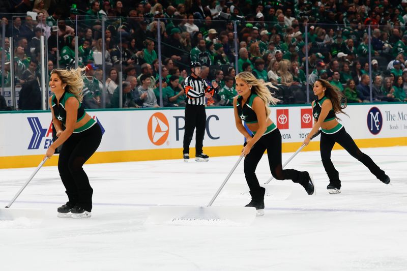 Oct 16, 2025; Dallas, Texas, USA; The Dallas Stars ICice Girls clear the ice during the first period at American Airlines Center. Mandatory Credit: Chris Jones-Imagn Images