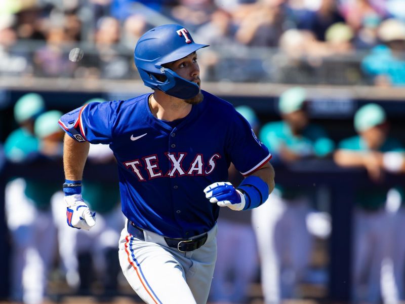 Mar 5, 2024; Peoria, Arizona, USA; Texas Rangers outfielder Evan Carter rounds the bases after hitting a home run against the Seattle Mariners during a spring training baseball game at Peoria Sports Complex. Mandatory Credit: Mark J. Rebilas-USA TODAY Sports