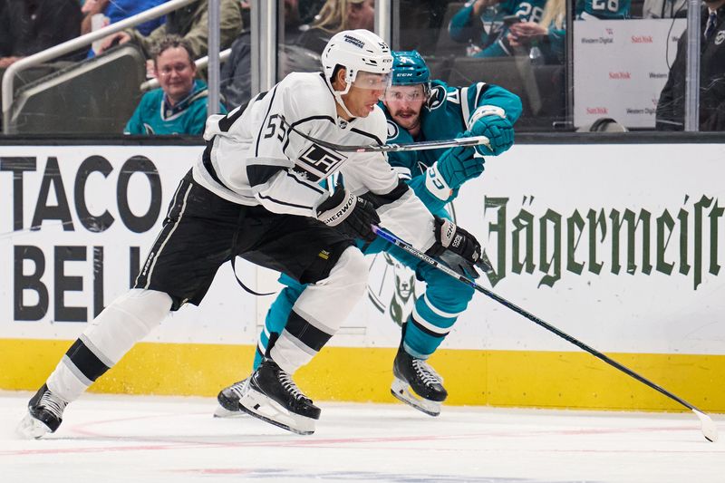 Apr 4, 2024; San Jose, California, USA; San Jose Sharks defenseman Kyle Burroughs (4) defends against Los Angeles Kings right wing Quinton Byfield (55) during the third period at SAP Center at San Jose. Mandatory Credit: Robert Edwards-USA TODAY Sports