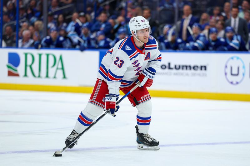 Apr 15, 2026; Tampa, Florida, USA; New York Rangers defenseman Adam Fox (23) controls the puck against the Tampa Bay Lightning in the second period at Benchmark International Arena. Mandatory Credit: Nathan Ray Seebeck-Imagn Images