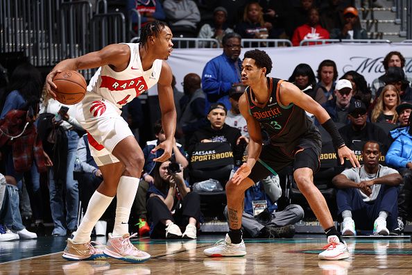 WASHINGTON, DC -? DECEMBER 27: Scottie Barnes #4 of the Toronto Raptors handles the ball while Jordan Poole #13 of the Washington Wizards plays defense during the game on December 27, 2023 at Capital One Arena in Washington, DC. NOTE TO USER: User expressly acknowledges and agrees that, by downloading and or using this Photograph, user is consenting to the terms and conditions of the Getty Images License Agreement. Mandatory Copyright Notice: Copyright 2023 NBAE (Photo by Kenny Giarla/NBAE via Getty Images)