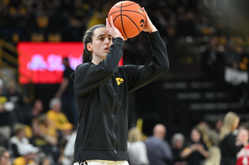 Mar 3, 2024; Iowa City, Iowa, USA; Iowa Hawkeyes guard Caitlin Clark (22) warms up before the game against the Ohio State Buckeyes at Carver-Hawkeye Arena. Clark is attempting to break the NCAA basketball all-time scoring record. Mandatory Credit: Jeffrey Becker-USA TODAY Sports