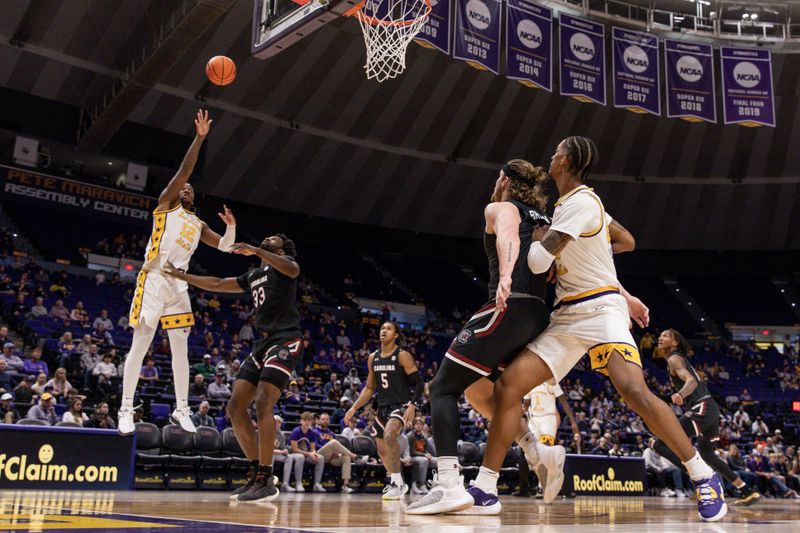 Feb 18, 2023; Baton Rouge, Louisiana, USA; LSU Tigers forward KJ Williams (12) shoots a jump shot against South Carolina Gamecocks forward Josh Gray (33) at Pete Maravich Assembly Center. Mandatory Credit: Stephen Lew-USA TODAY Sports