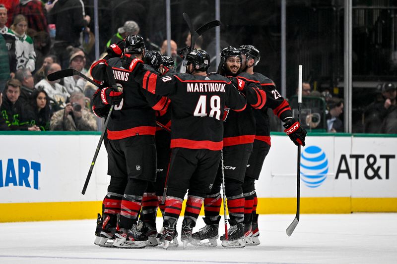 Jan 25, 2023; Dallas, Texas, USA; Carolina Hurricanes defenseman Brett Pesce (22) and defenseman Jalen Chatfield (5) and defenseman Brent Burns (8) and left wing Jordan Martinook (48) and right wing Stefan Noesen (23) celebrate scoring the game winning goal against the Dallas Stars during the overtime period at the American Airlines Center. Mandatory Credit: Jerome Miron-USA TODAY Sports