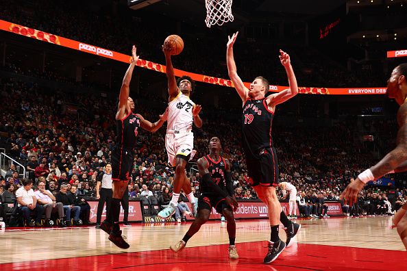 TORONTO, CANADA - DECEMBER 23:  Colin Sexton #2 of the Utah Jazz drives to the basket during the game against the Toronto Raptors on December 23, 2023 at the Scotiabank Arena in Toronto, Ontario, Canada.  NOTE TO USER: User expressly acknowledges and agrees that, by downloading and or using this Photograph, user is consenting to the terms and conditions of the Getty Images License Agreement.  Mandatory Copyright Notice: Copyright 2023 NBAE (Photo by Vaughn Ridley/NBAE via Getty Images)