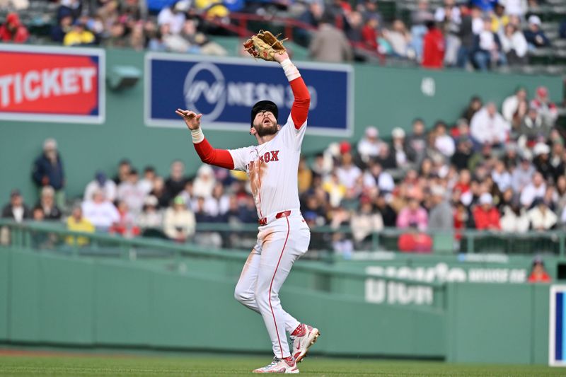Apr 10, 2025; Boston, Massachusetts, USA; Boston Red Sox shortstop Trevor Story (10) makes a catch during the fifth inning against the Toronto Blue Jays at Fenway Park. Mandatory Credit: Eric Canha-Imagn Images