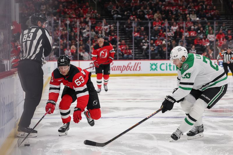 Dec 3, 2025; Newark, New Jersey, USA; New Jersey Devils left wing Jesper Bratt (63) skates with the puck as Dallas Stars defenseman Esa Lindell (23) defends during the second period at Prudential Center. Mandatory Credit: Ed Mulholland-Imagn Images