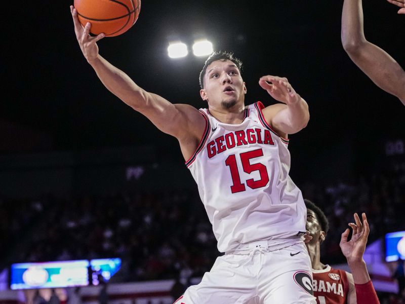 Jan 31, 2024; Athens, Georgia, USA; Georgia Bulldogs guard RJ Melendez (15) tries to score against the Alabama Crimson Tide during the first half at Stegeman Coliseum. Mandatory Credit: Dale Zanine-USA TODAY Sports