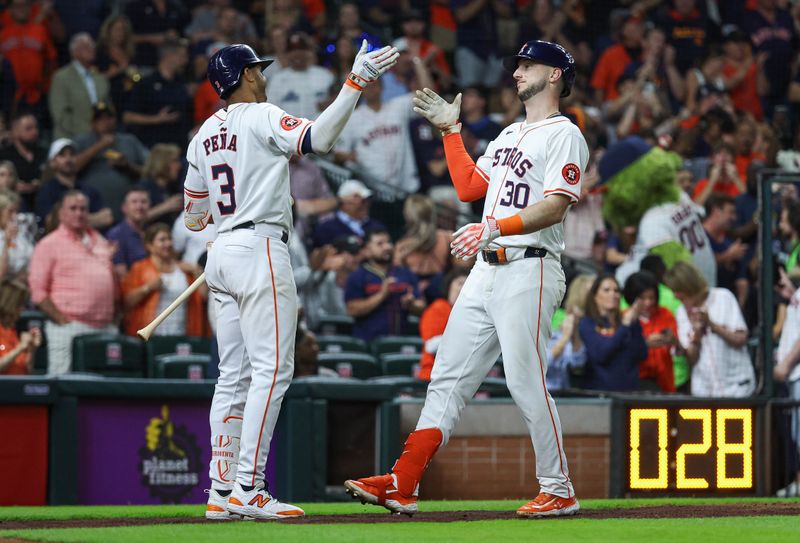 May 1, 2024; Houston, Texas, USA;  Houston Astros right fielder Kyle Tucker (30) celebrates with shortstop Jeremy Pena (3) after hitting a home run during the seventh inning against the Cleveland Guardians at Minute Maid Park. Mandatory Credit: Troy Taormina-USA TODAY Sports