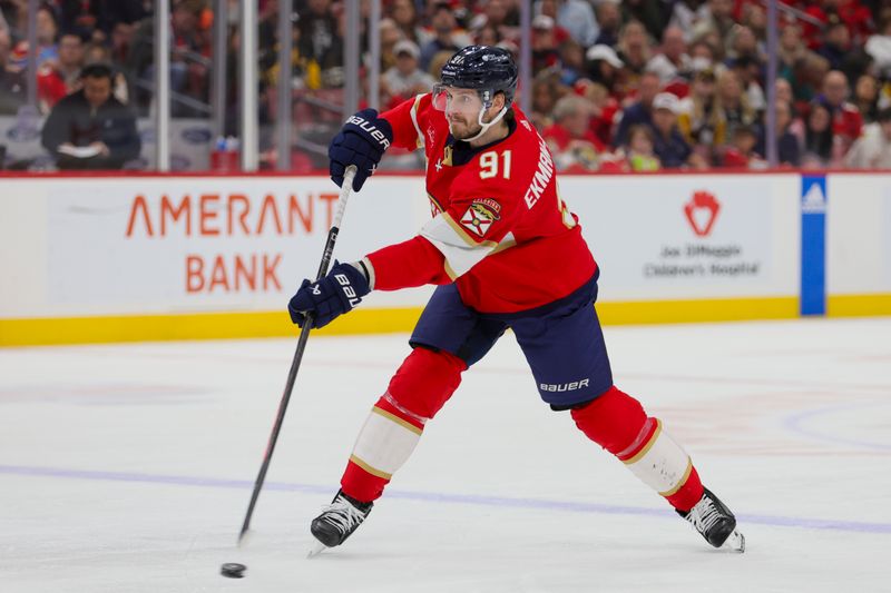 Dec 8, 2023; Sunrise, Florida, USA; Florida Panthers defenseman Oliver Ekman-Larsson (91) shoots the puck against the Pittsburgh Penguins during the second period  at Amerant Bank Arena. Mandatory Credit: Sam Navarro-USA TODAY Sports