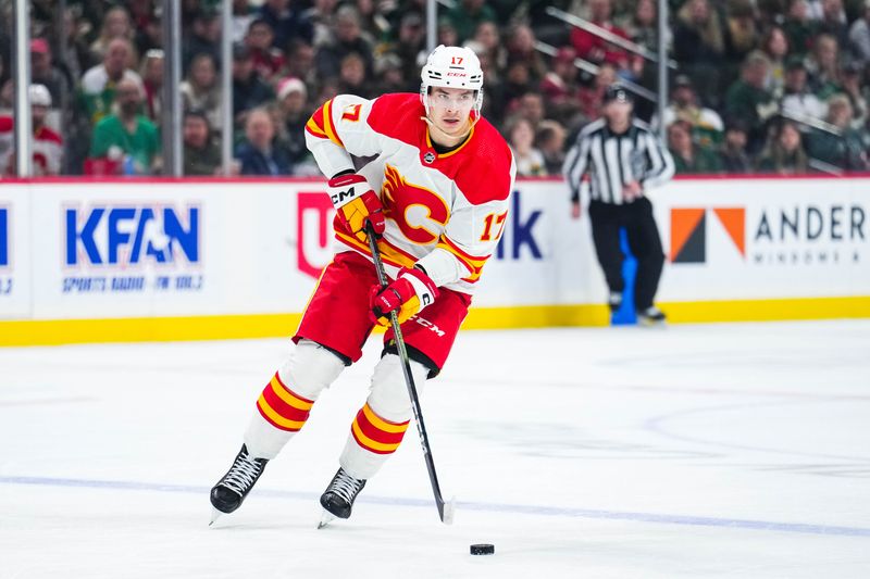 Jan 2, 2024; Saint Paul, Minnesota, USA; Calgary Flames center Yegor Sharangovich (17) carries the puck during the first period against the Minnesota Wild at Xcel Energy Center. Mandatory Credit: Brace Hemmelgarn-USA TODAY Sports