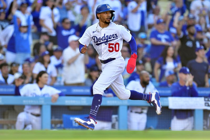 Jun 25, 2023; Los Angeles, California, USA; Los Angeles Dodgers second baseman Mookie Betts (50) runs home to score against the Houston Astros during the eighth inning at Dodger Stadium. Mandatory Credit: Gary A. Vasquez-USA TODAY Sports